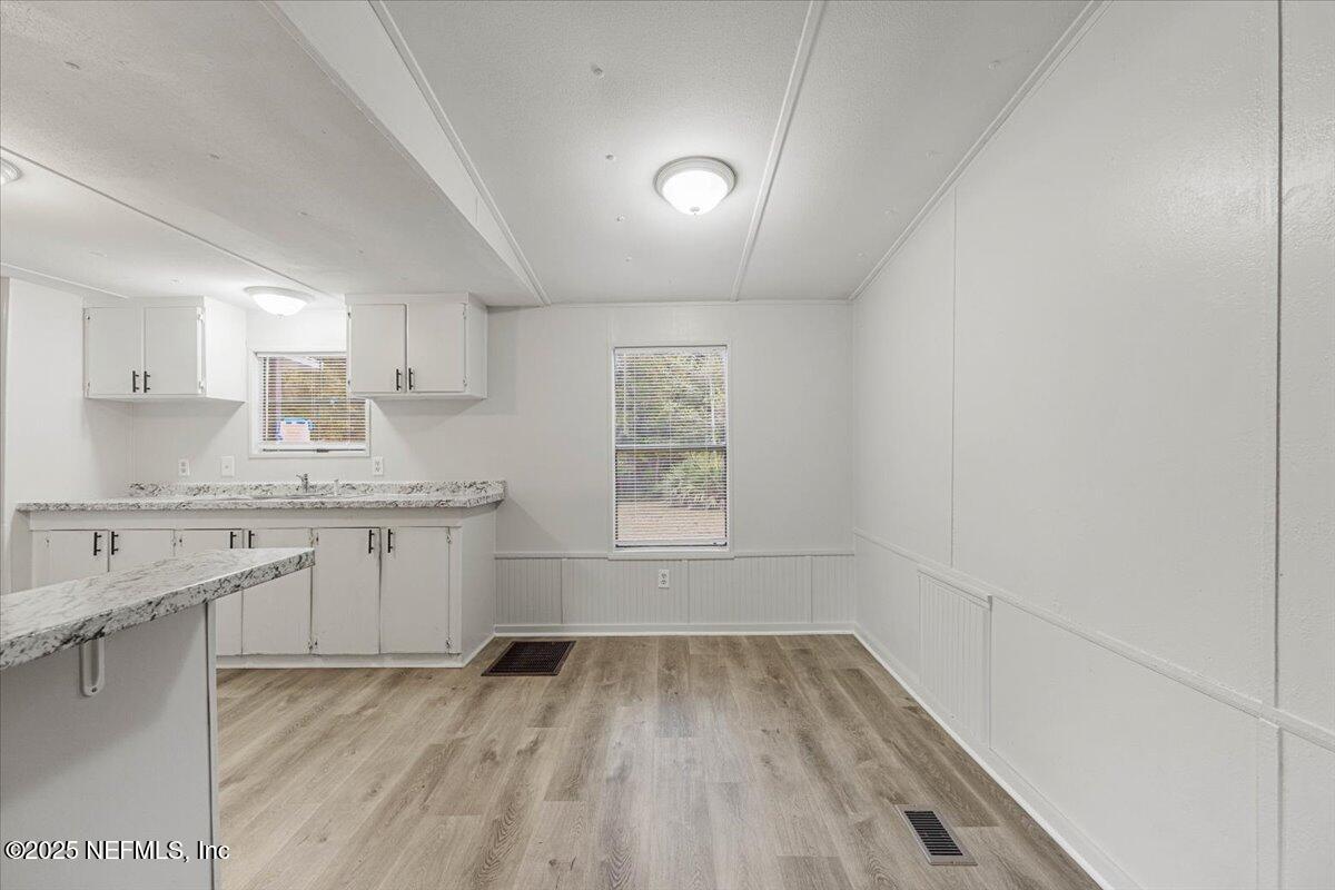 1480 Brangus Road Middleburg, FL 32068 - Photo 7 of 24 a view of a kitchen with granite countertop cabinets and sink