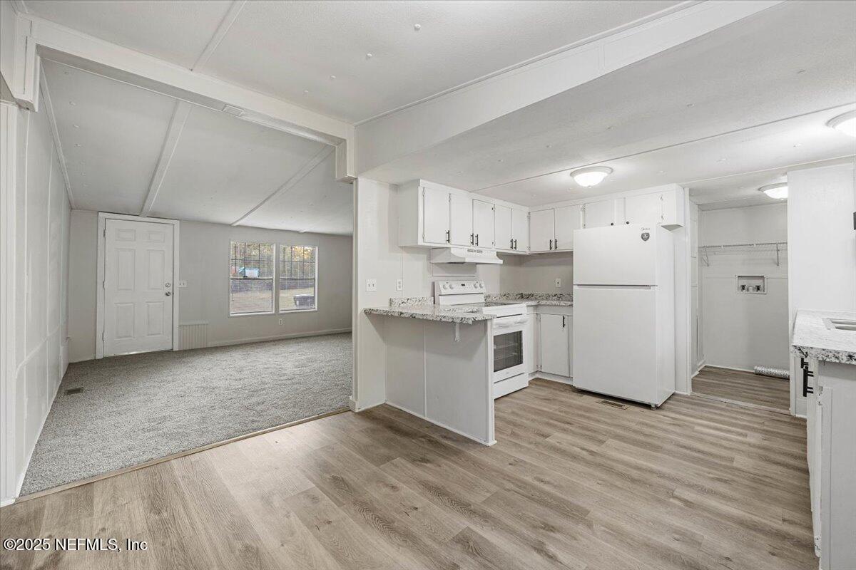 1480 Brangus Road Middleburg, FL 32068 - Photo 8 of 24 a view of kitchen with wooden floor