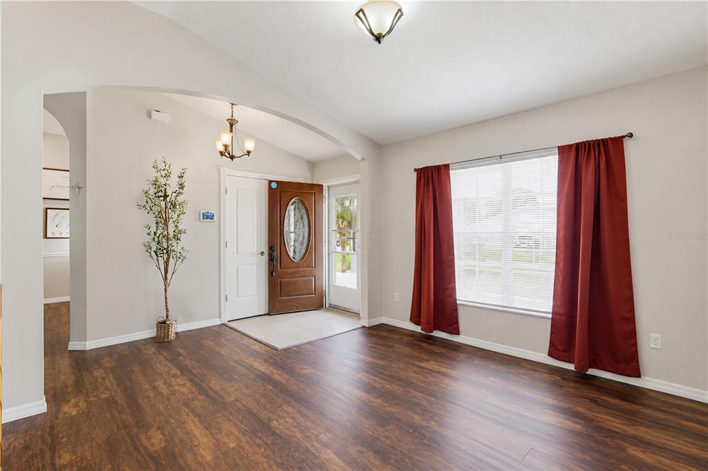 3497 Chadwick Avenue Spring Hill, FL 34609 - Photo 21 of 47 an empty room with window and wooden floor