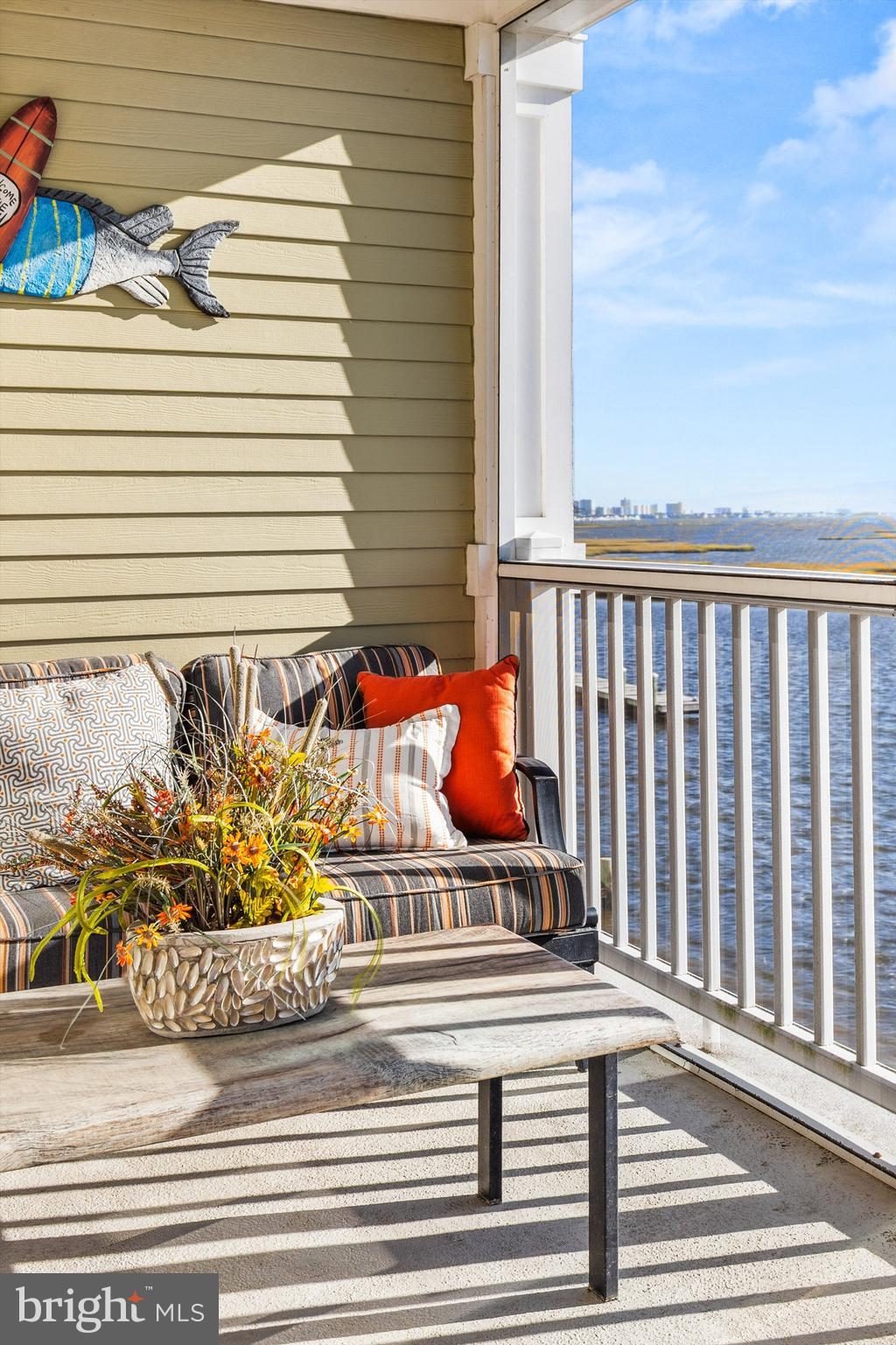 37286 Lighthouse Road, Unit 210 Selbyville, DE 19975 - Photo 22 of 75 a view of a balcony with potted plants