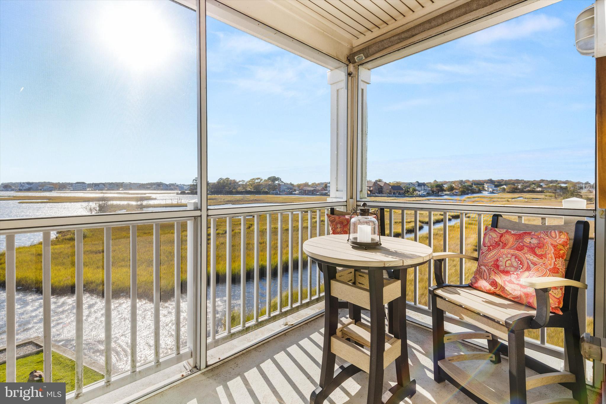 37286 Lighthouse Road, Unit 210 Selbyville, DE 19975 - Photo 23 of 75 a view of a balcony with furniture and city view
