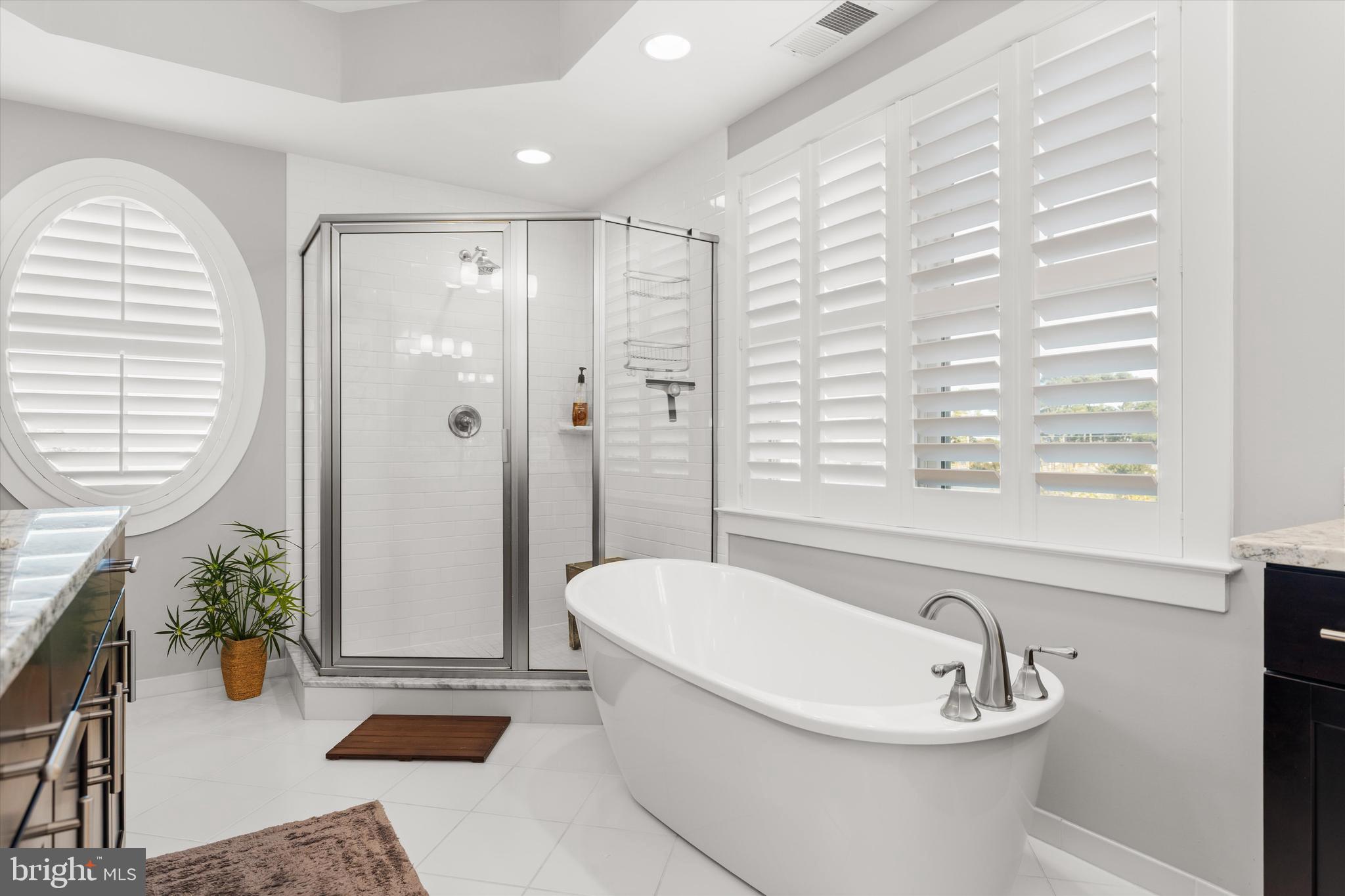 37286 Lighthouse Road, Unit 210 Selbyville, DE 19975 - Photo 45 of 75 a bathroom with a sink a bathtub and next to a window