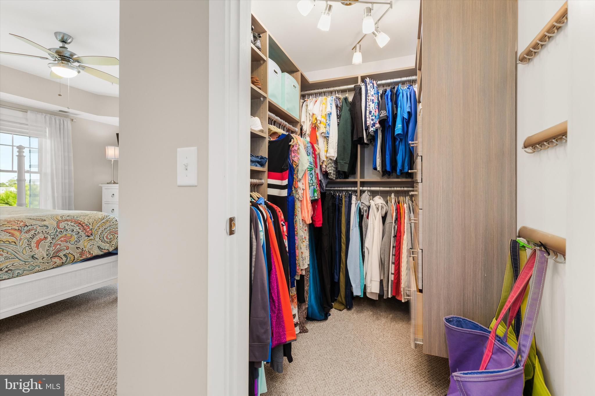37286 Lighthouse Road, Unit 210 Selbyville, DE 19975 - Photo 47 of 75 a view of walk in closet with clothes and shoes