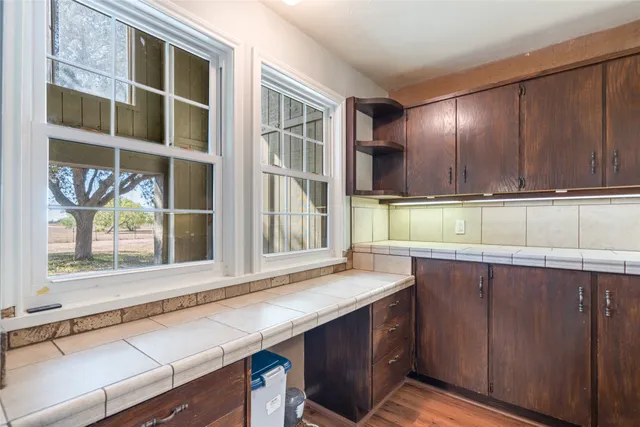a kitchen with a sink and a window