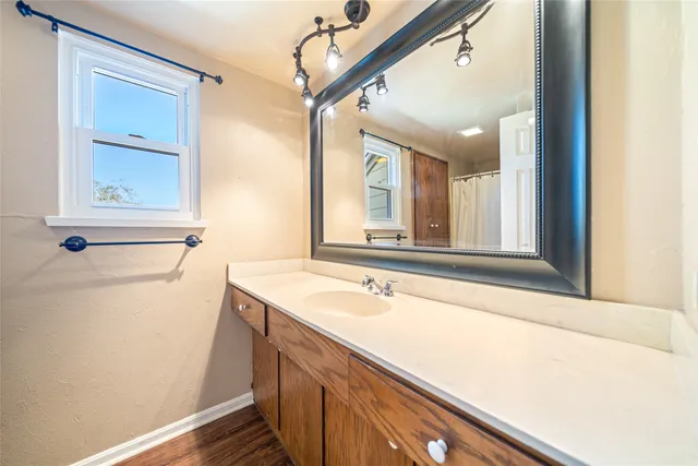 a bathroom with a sink and a mirror