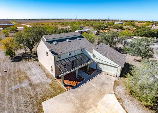 an aerial view of house with yard
