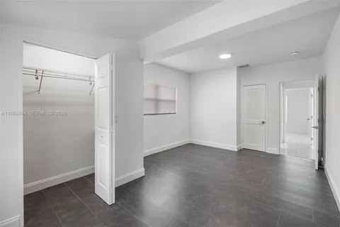 an empty room with a bench