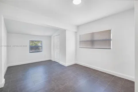 a bathroom with a sink mirror vanity and toilet