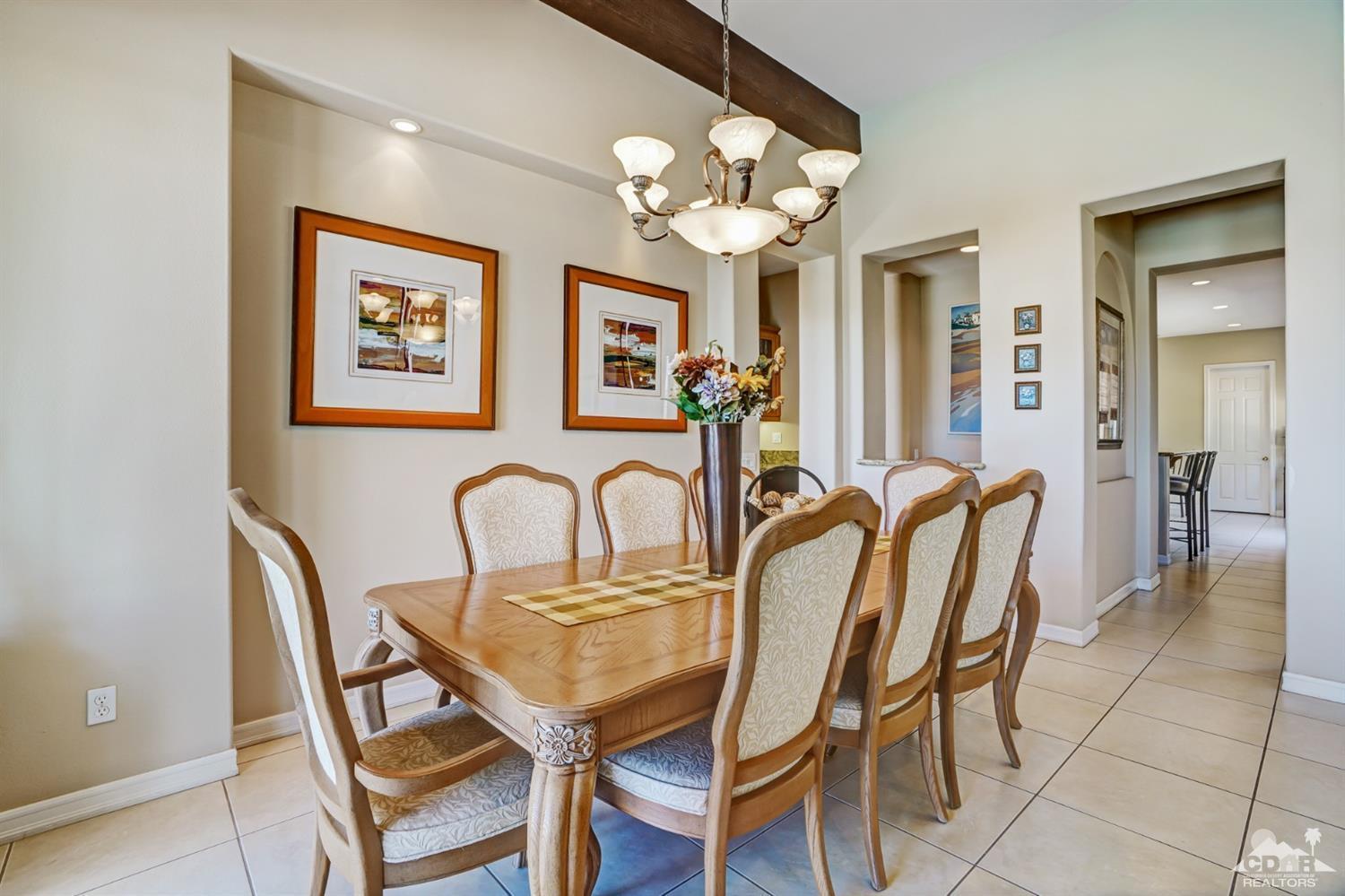 329 Loch Lomond Road Rancho Mirage, CA 92270 - Photo 12 of 50 a dining room with furniture and chandelier