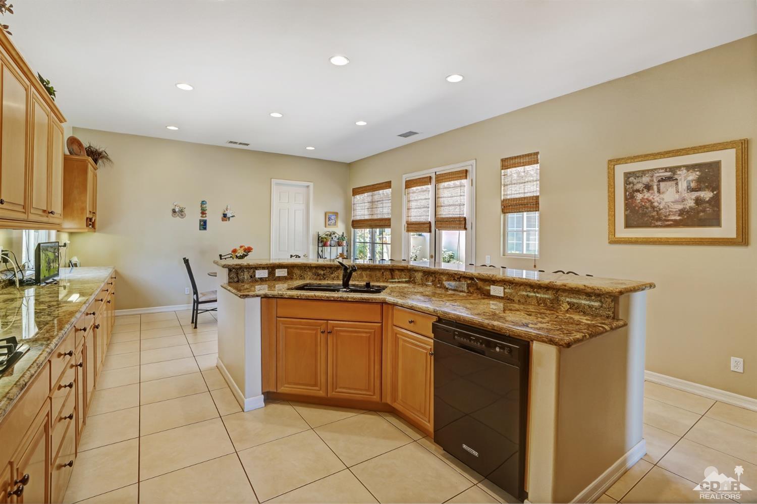 329 Loch Lomond Road Rancho Mirage, CA 92270 - Photo 17 of 50 a kitchen with a sink and cabinets