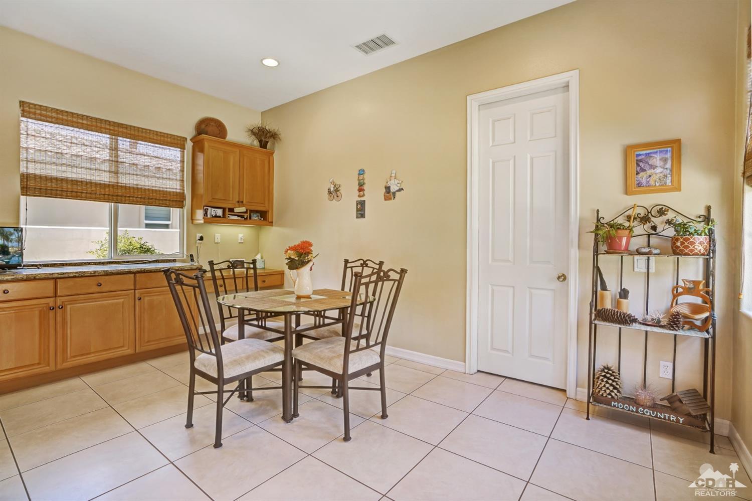 329 Loch Lomond Road Rancho Mirage, CA 92270 - Photo 19 of 50 a dining room with furniture and window