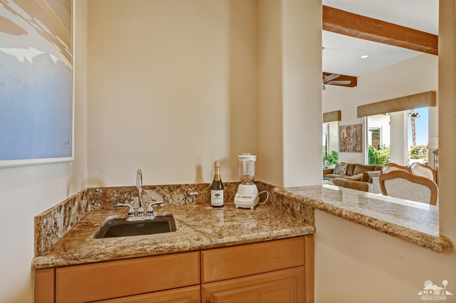 329 Loch Lomond Road Rancho Mirage, CA 92270 - Photo 21 of 50 a bathroom with a granite countertop sink and a mirror