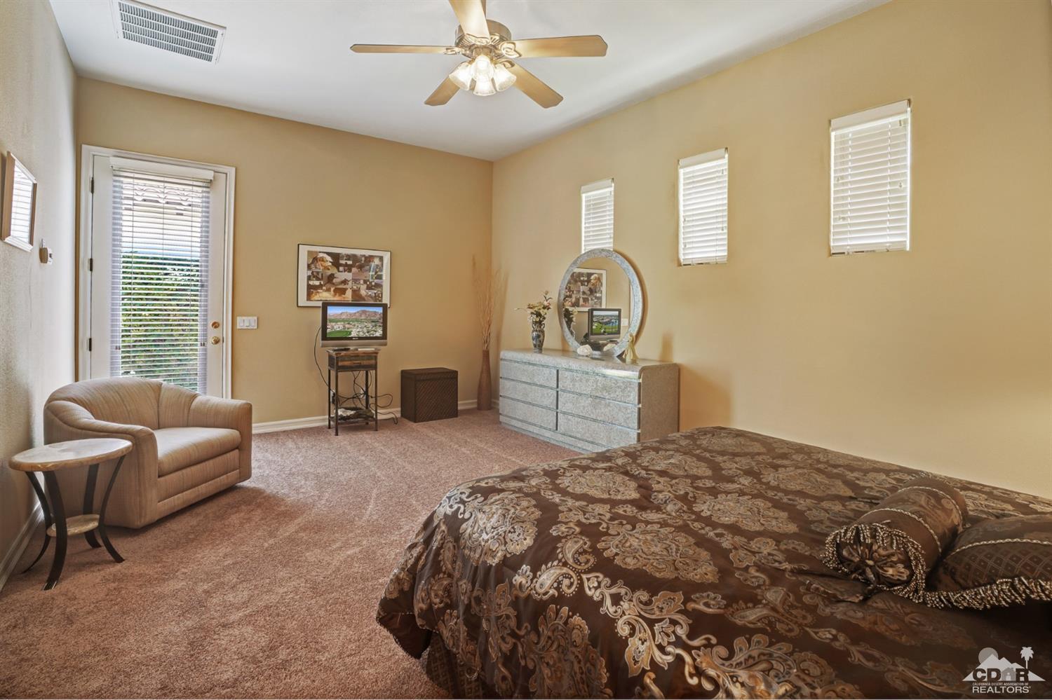 329 Loch Lomond Road Rancho Mirage, CA 92270 - Photo 31 of 50 a bedroom with a bed and furniture