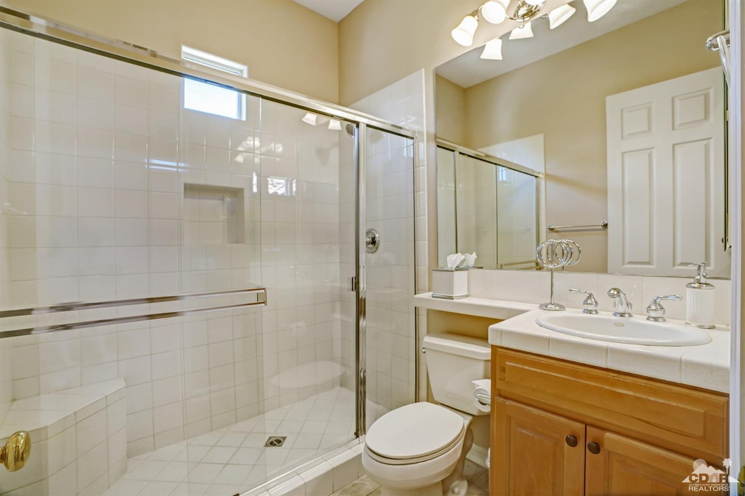 329 Loch Lomond Road Rancho Mirage, CA 92270 - Photo 32 of 50 a bathroom with a sink a toilet and shower