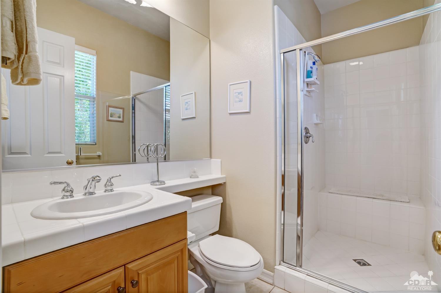 329 Loch Lomond Road Rancho Mirage, CA 92270 - Photo 34 of 50 a bathroom with a sink toilet vanity and shower