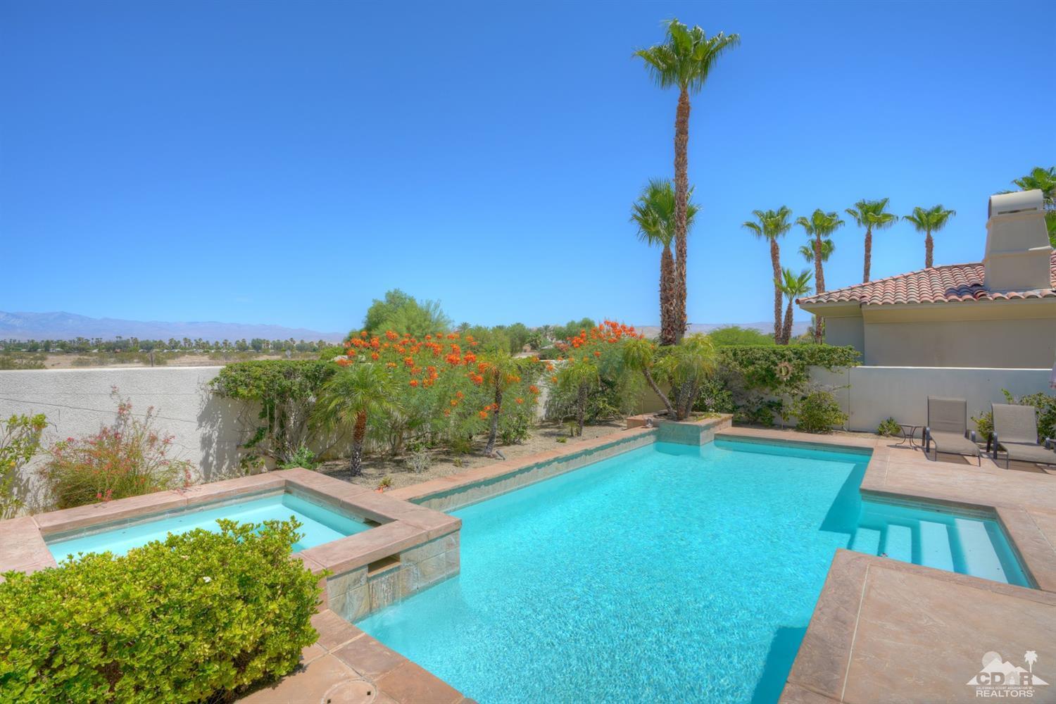 329 Loch Lomond Road Rancho Mirage, CA 92270 - Photo 40 of 50 a view of a yard with furniture and a lake view