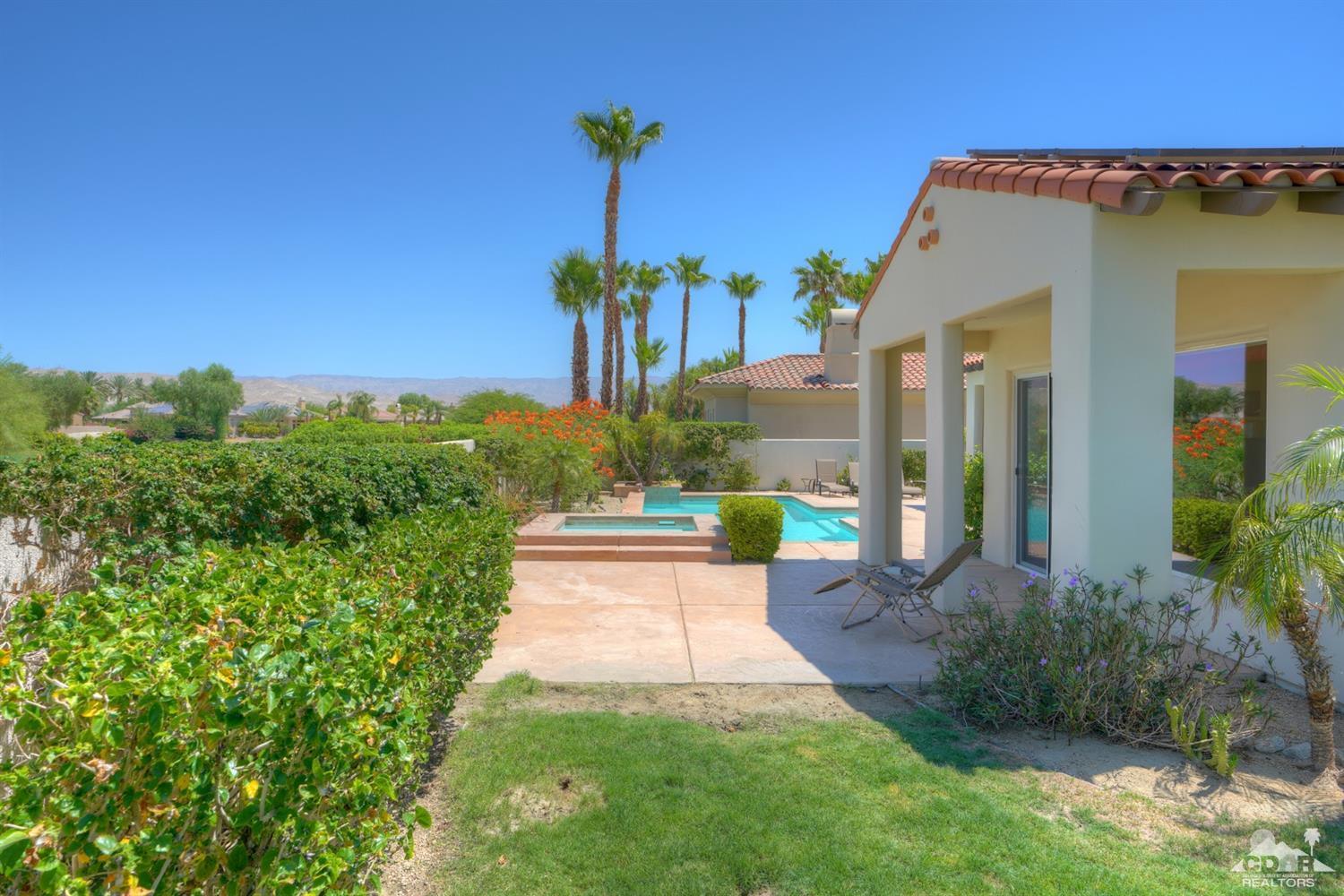 329 Loch Lomond Road Rancho Mirage, CA 92270 - Photo 42 of 50 a front view of a house with a yard