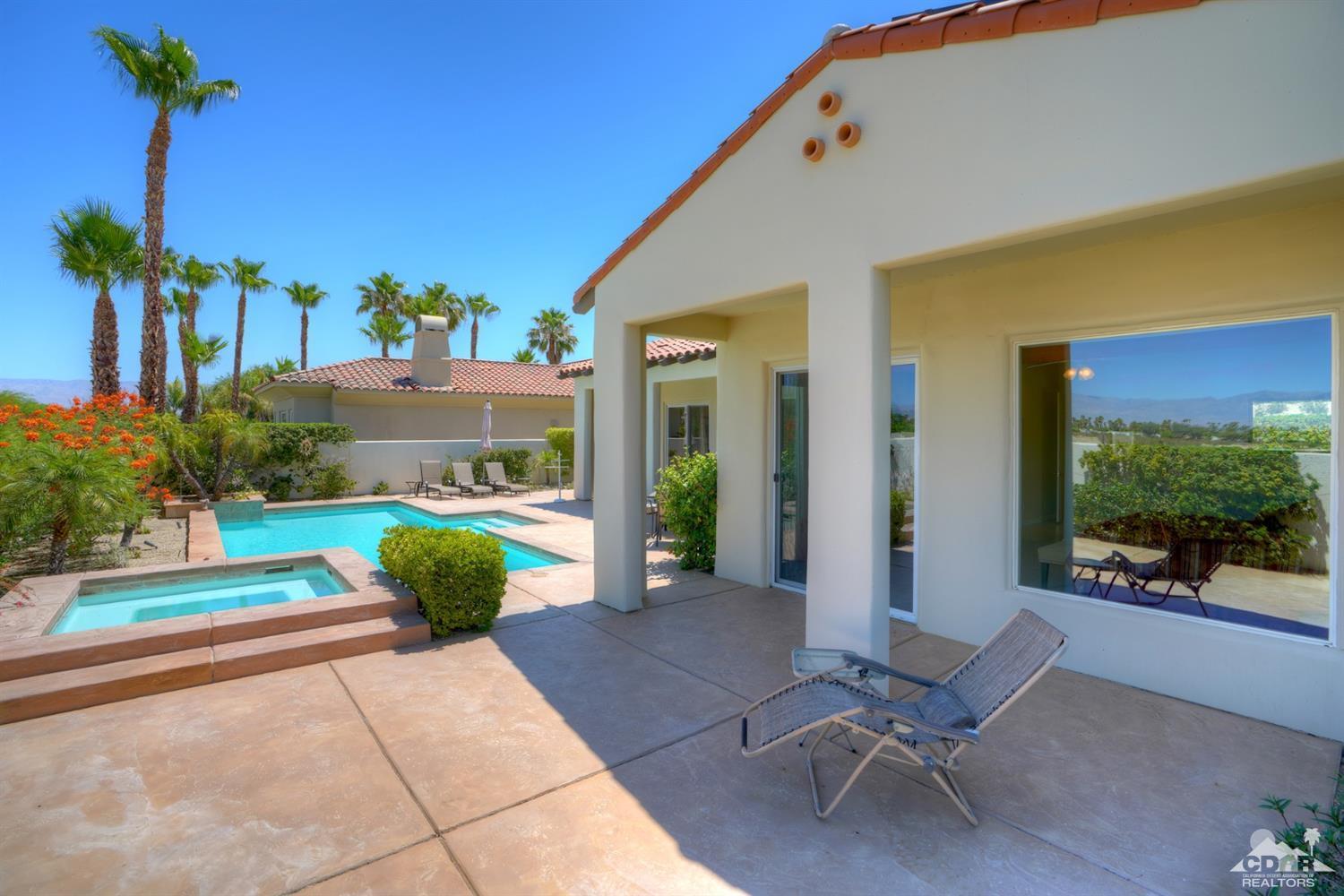 329 Loch Lomond Road Rancho Mirage, CA 92270 - Photo 43 of 50 a view of a chairs and table in patio with a fire pit