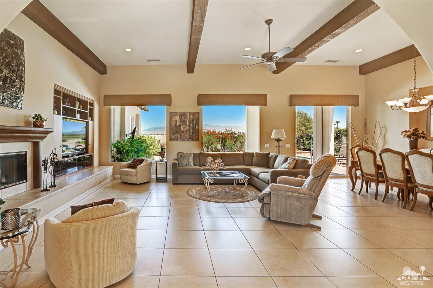 329 Loch Lomond Road Rancho Mirage, CA 92270 - Photo 7 of 50 a living room with furniture and a fireplace