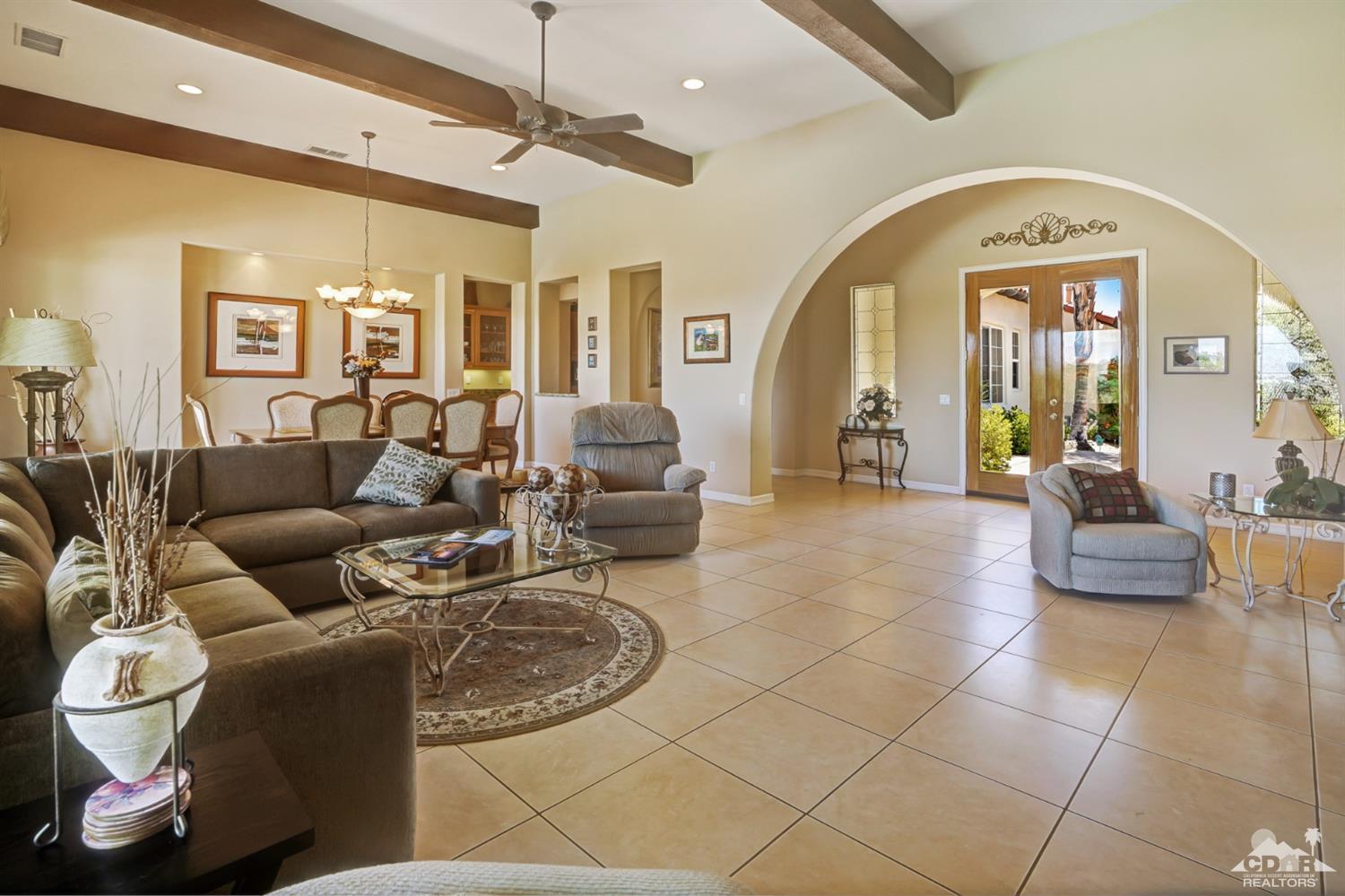 329 Loch Lomond Road Rancho Mirage, CA 92270 - Photo 10 of 50 a living room with furniture and a large window