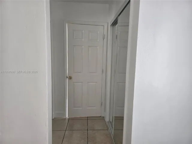 a view of an empty room and window