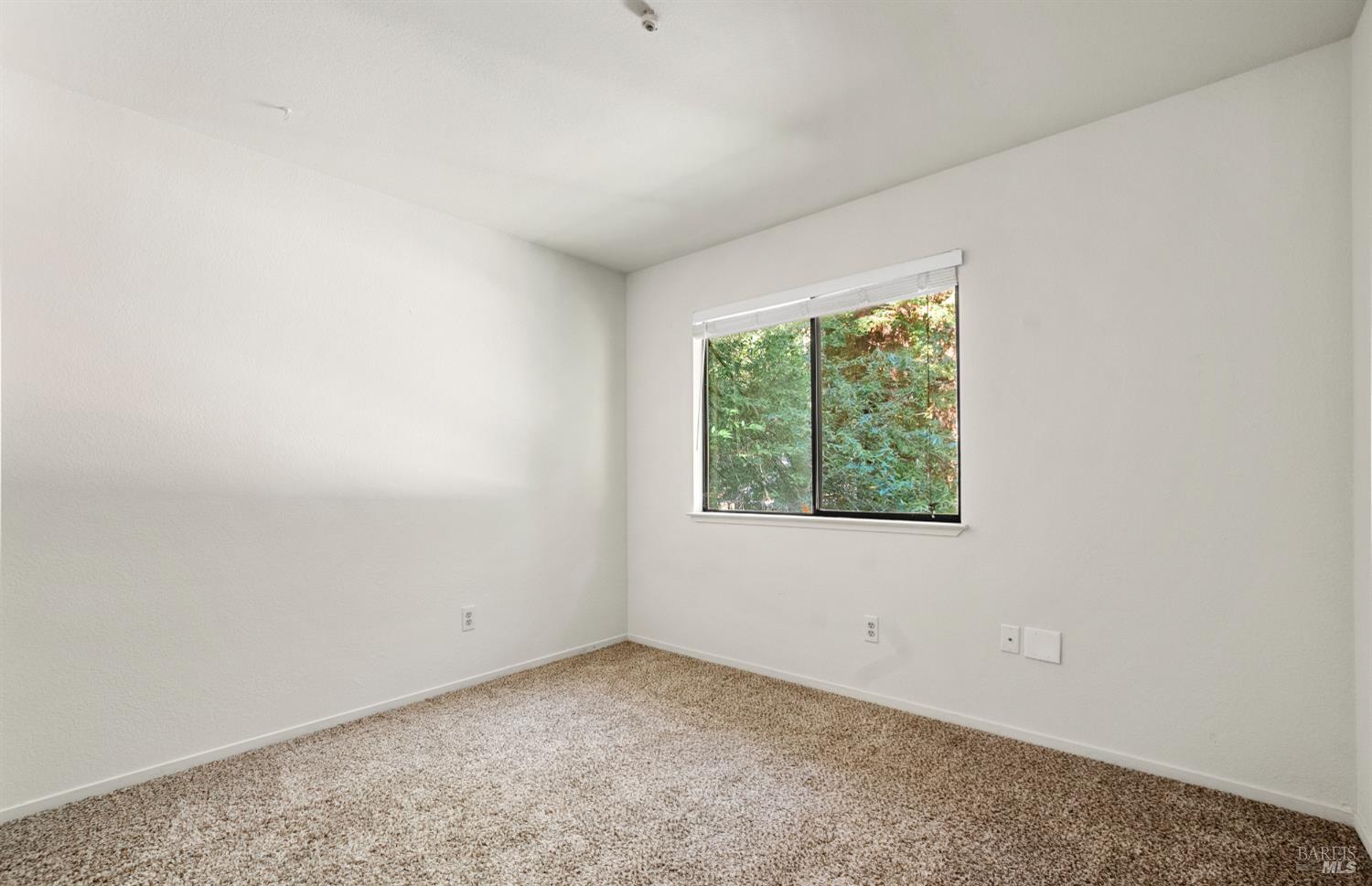 14571 Canyon 1 Road Guerneville, CA 95446 - Photo 18 of 37 an empty room with a window
