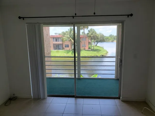 a view of a room that has a bed in it