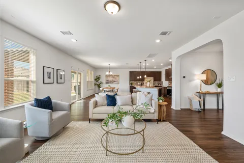 a living room with furniture or couch and a wooden floor