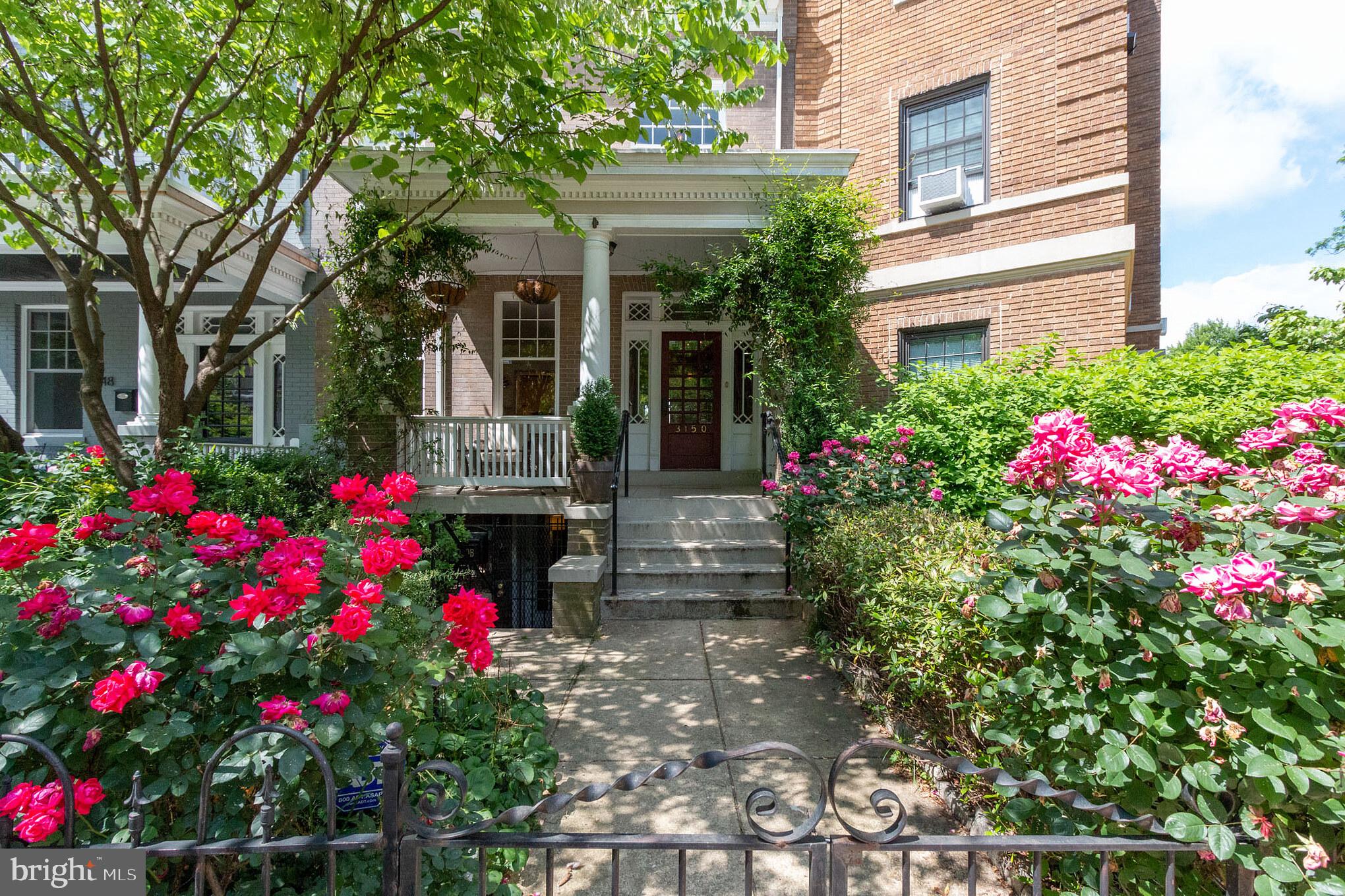 3150 19th Street Northwest Washington, DC 20010 - Photo 1 of 30 a view of a house with flower garden