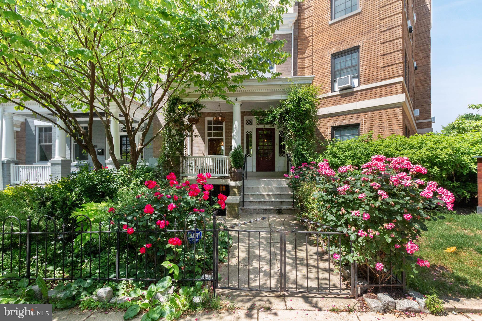 3150 19th Street Northwest Washington, DC 20010 - Photo 2 of 30 a view of a flower garden in front of a house