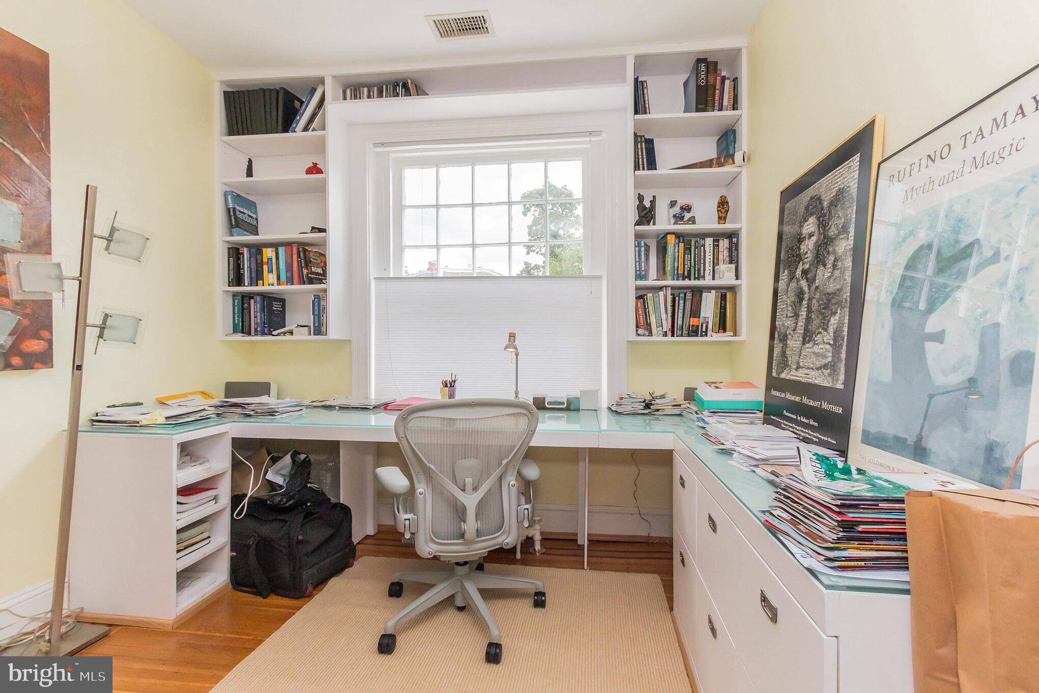 3150 19th Street Northwest Washington, DC 20010 - Photo 25 of 30 a view of a workspace with furniture and a window