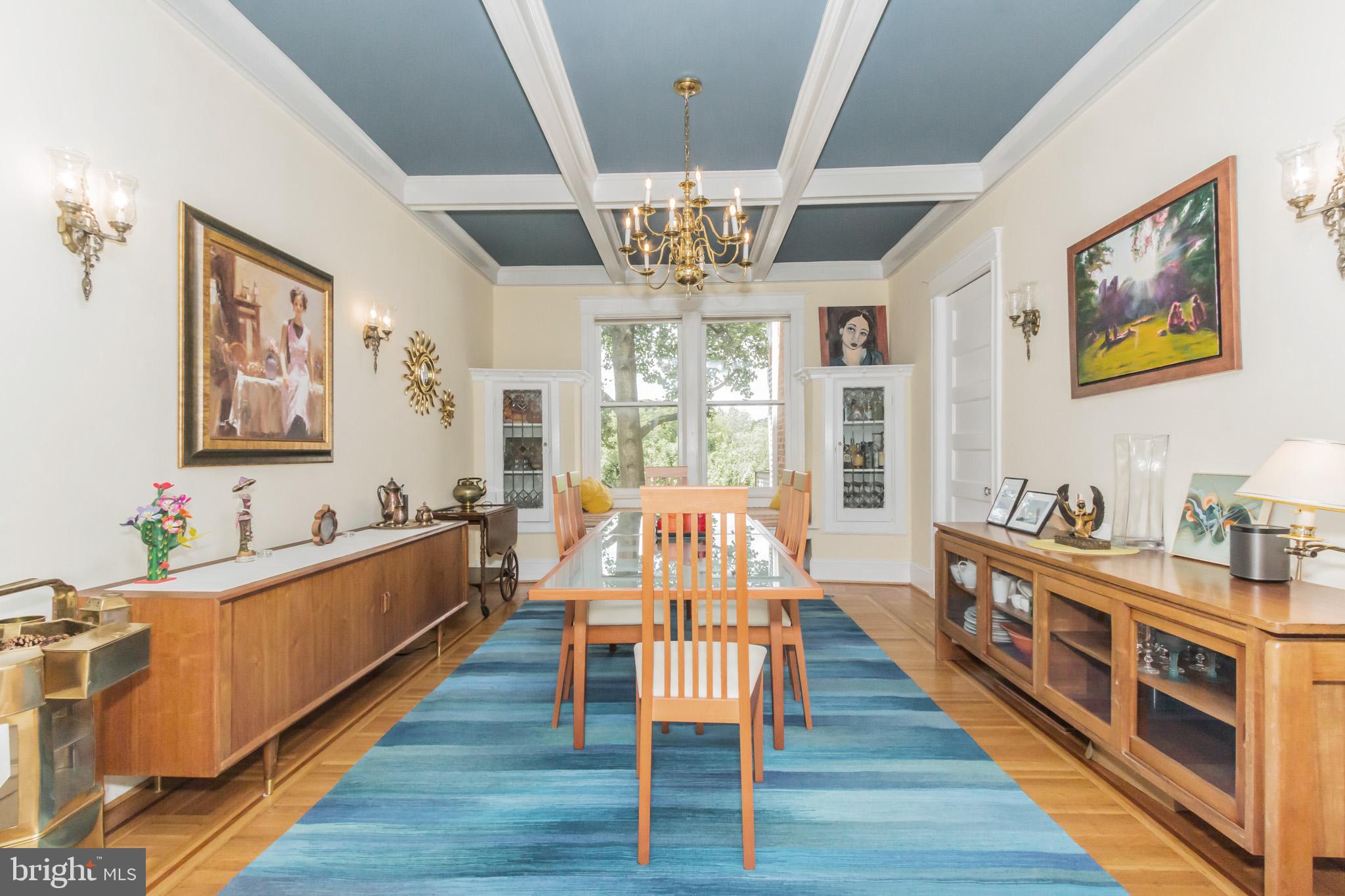 3150 19th Street Northwest Washington, DC 20010 - Photo 10 of 30 a view of a dining room with furniture a chandelier and wooden floor