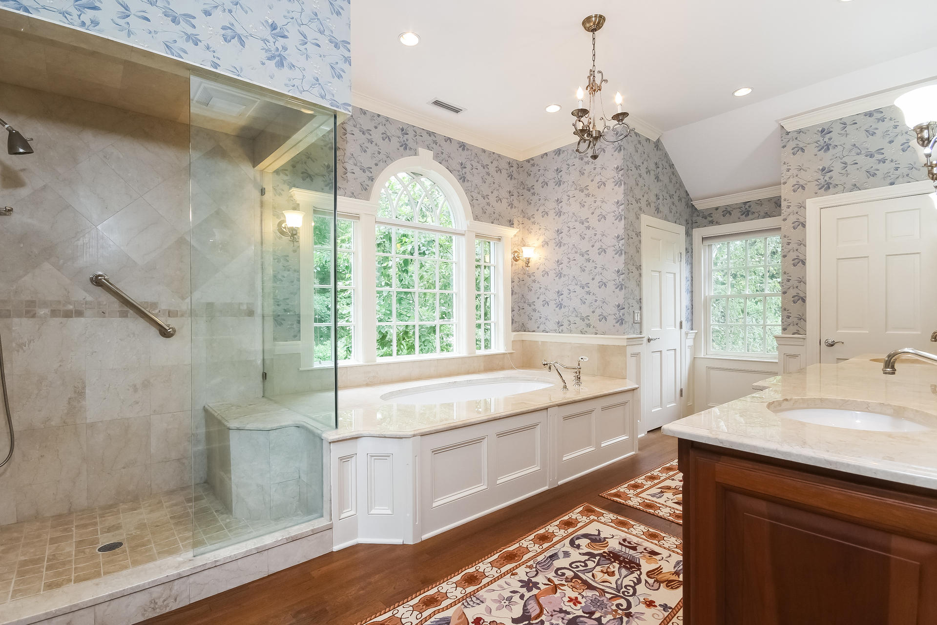 447 Valley Road New Canaan, CT 06840 - Photo 23 of 49 a bathroom with a bathtub sink and mirror