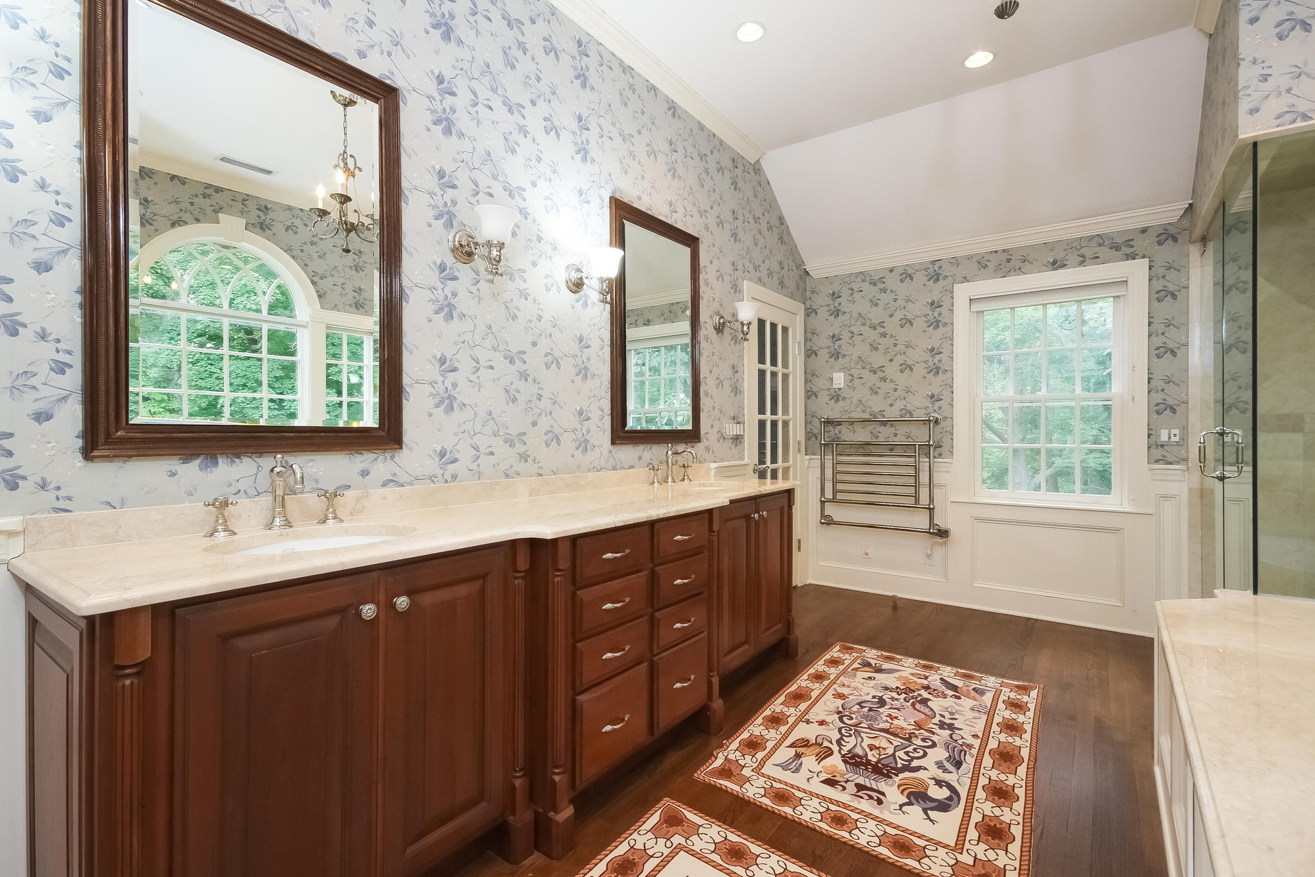 447 Valley Road New Canaan, CT 06840 - Photo 24 of 49 a large bathroom with double vanity and a large mirror
