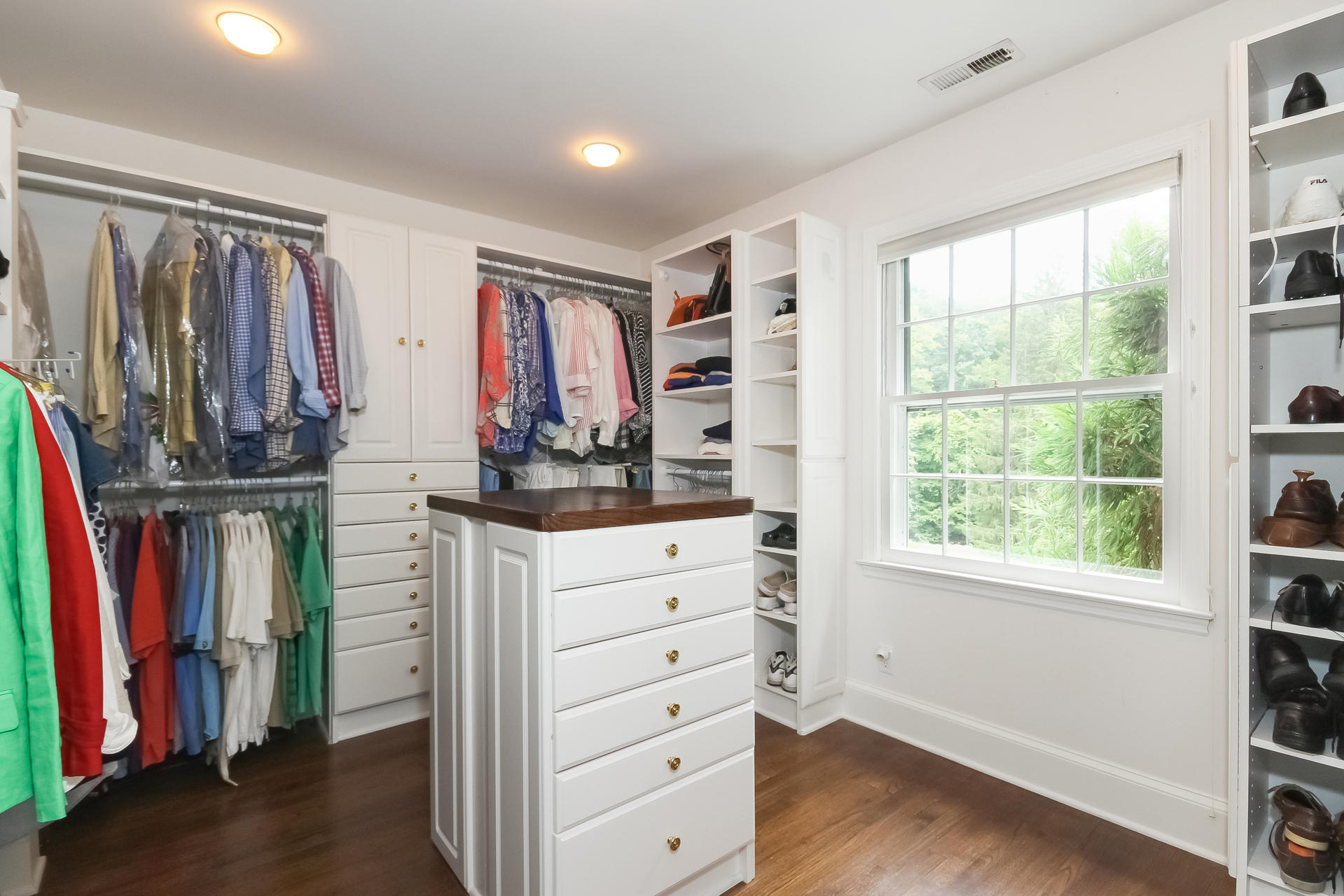 447 Valley Road New Canaan, CT 06840 - Photo 25 of 49 a view of walk in closet with clothes and shoes