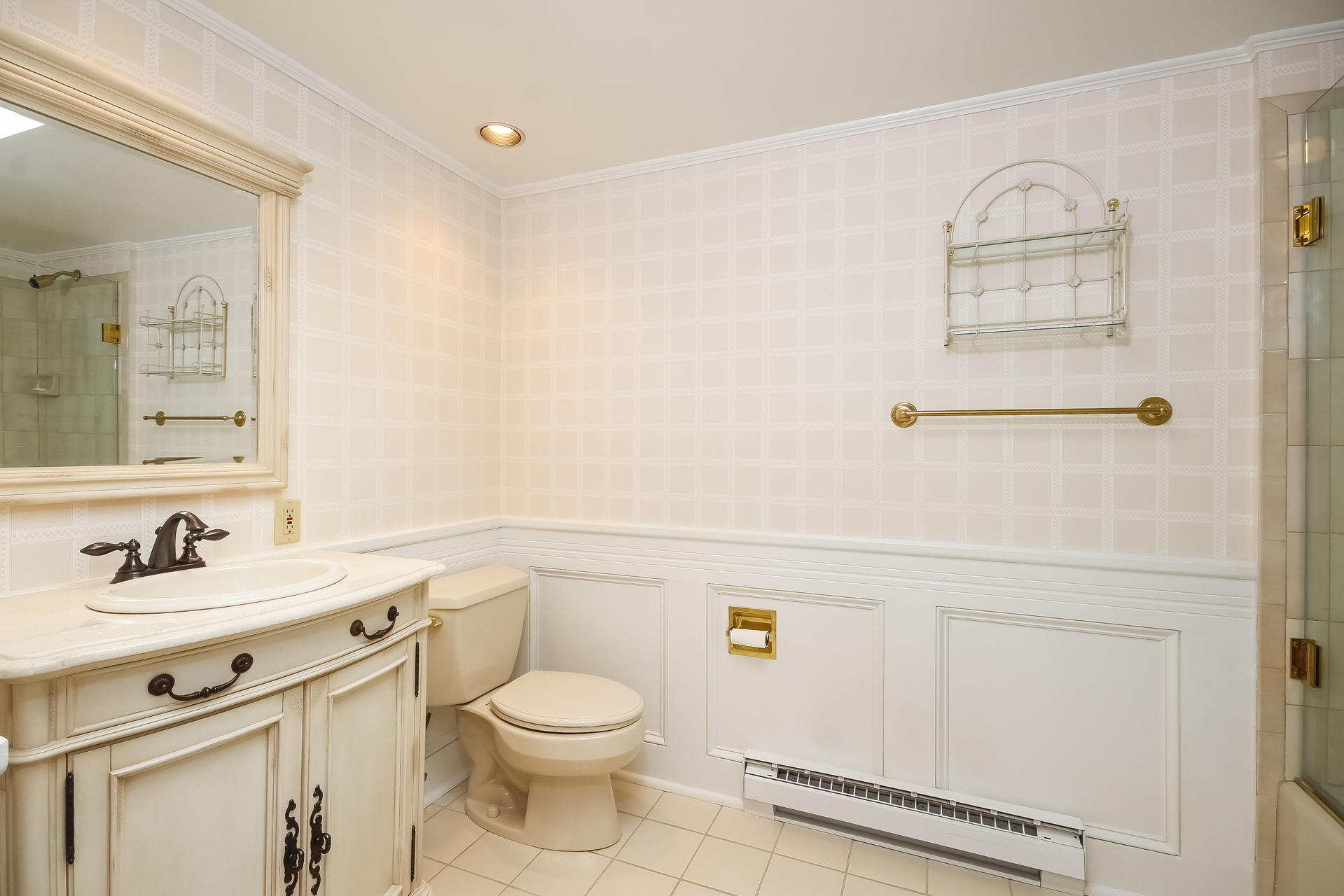 447 Valley Road New Canaan, CT 06840 - Photo 33 of 49 a bathroom with a granite countertop sink mirror vanity and toilet