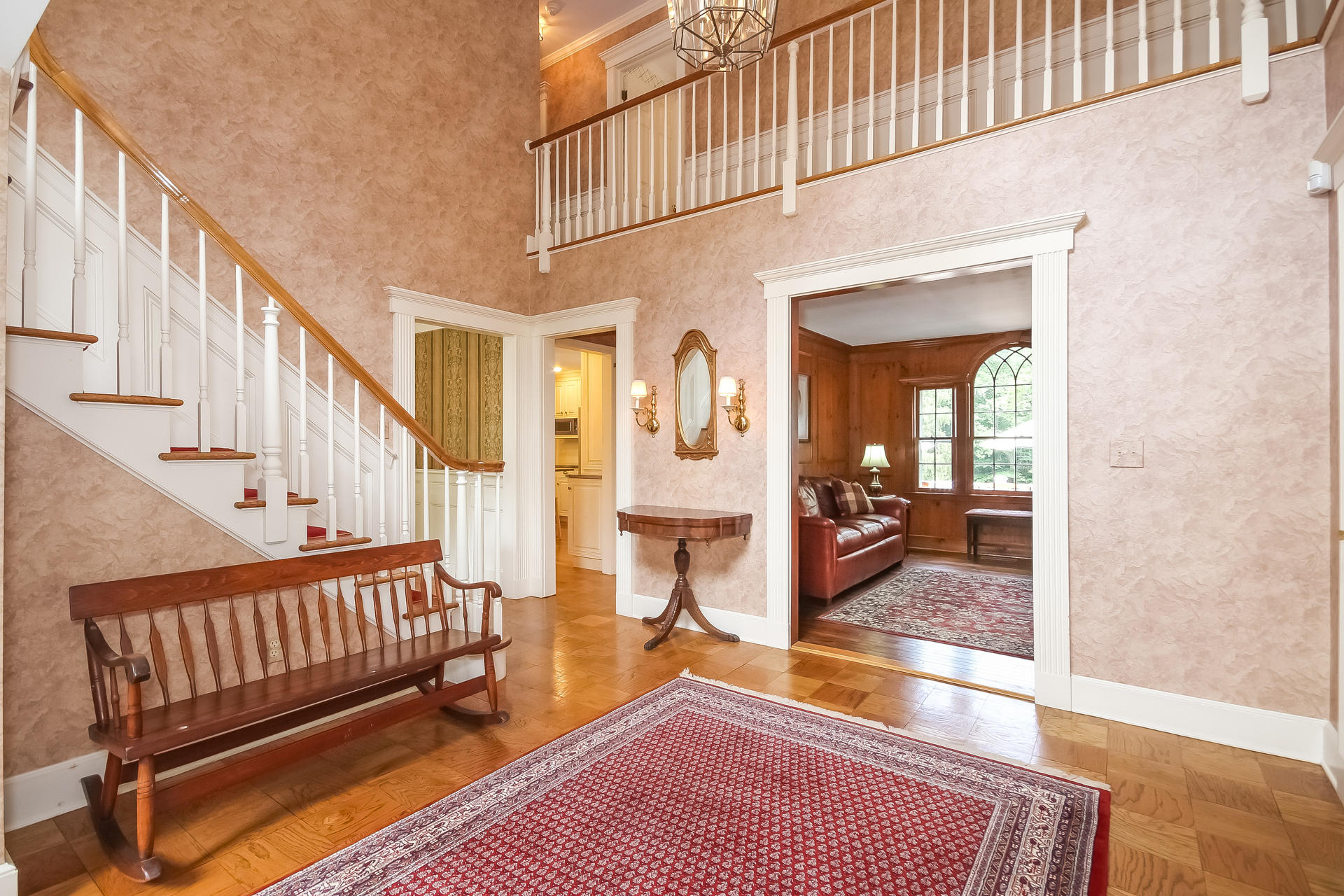 447 Valley Road New Canaan, CT 06840 - Photo 4 of 49 a view of an entryway wooden floor and a livingroom