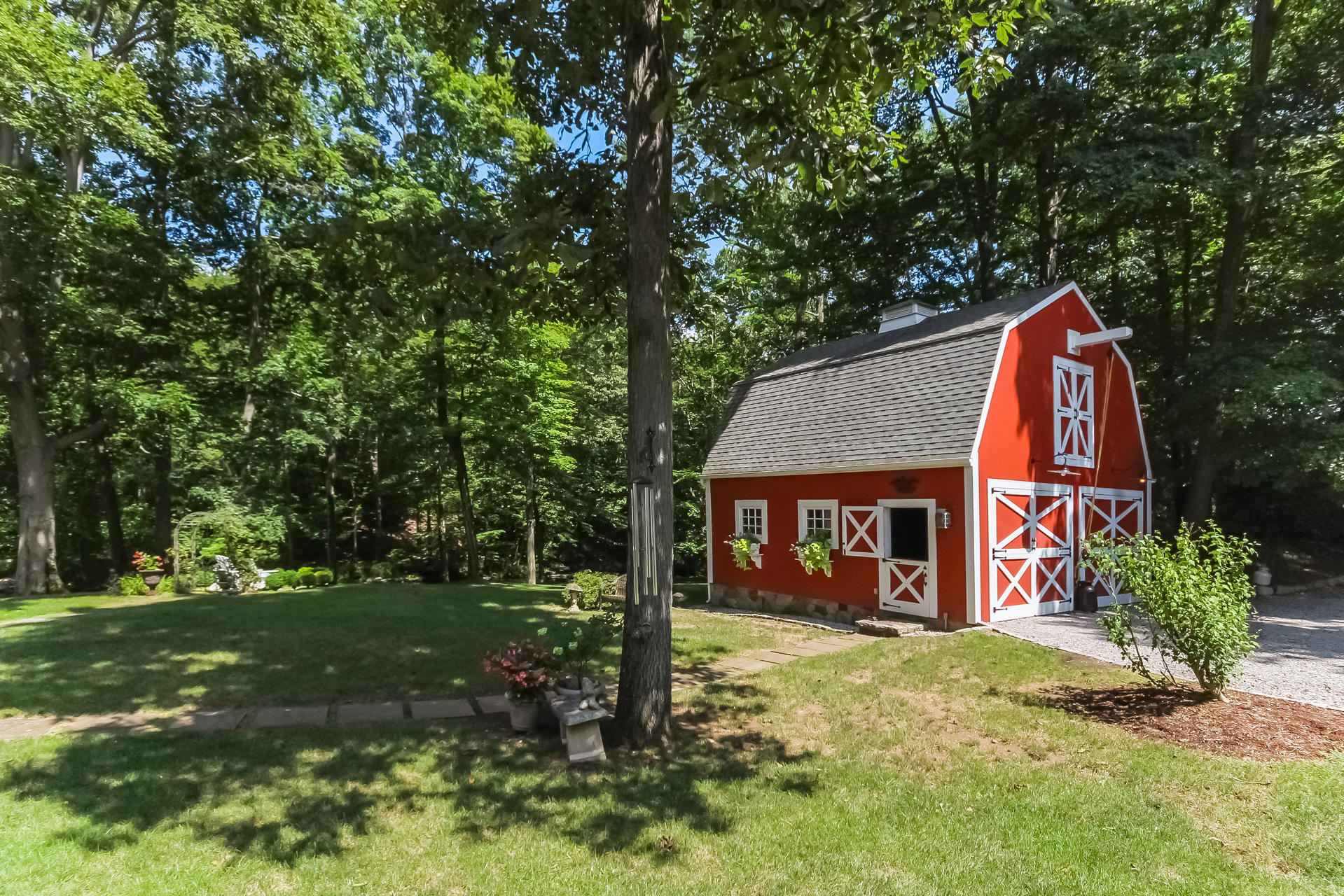 447 Valley Road New Canaan, CT 06840 - Photo 42 of 49 a view of a house with a yard