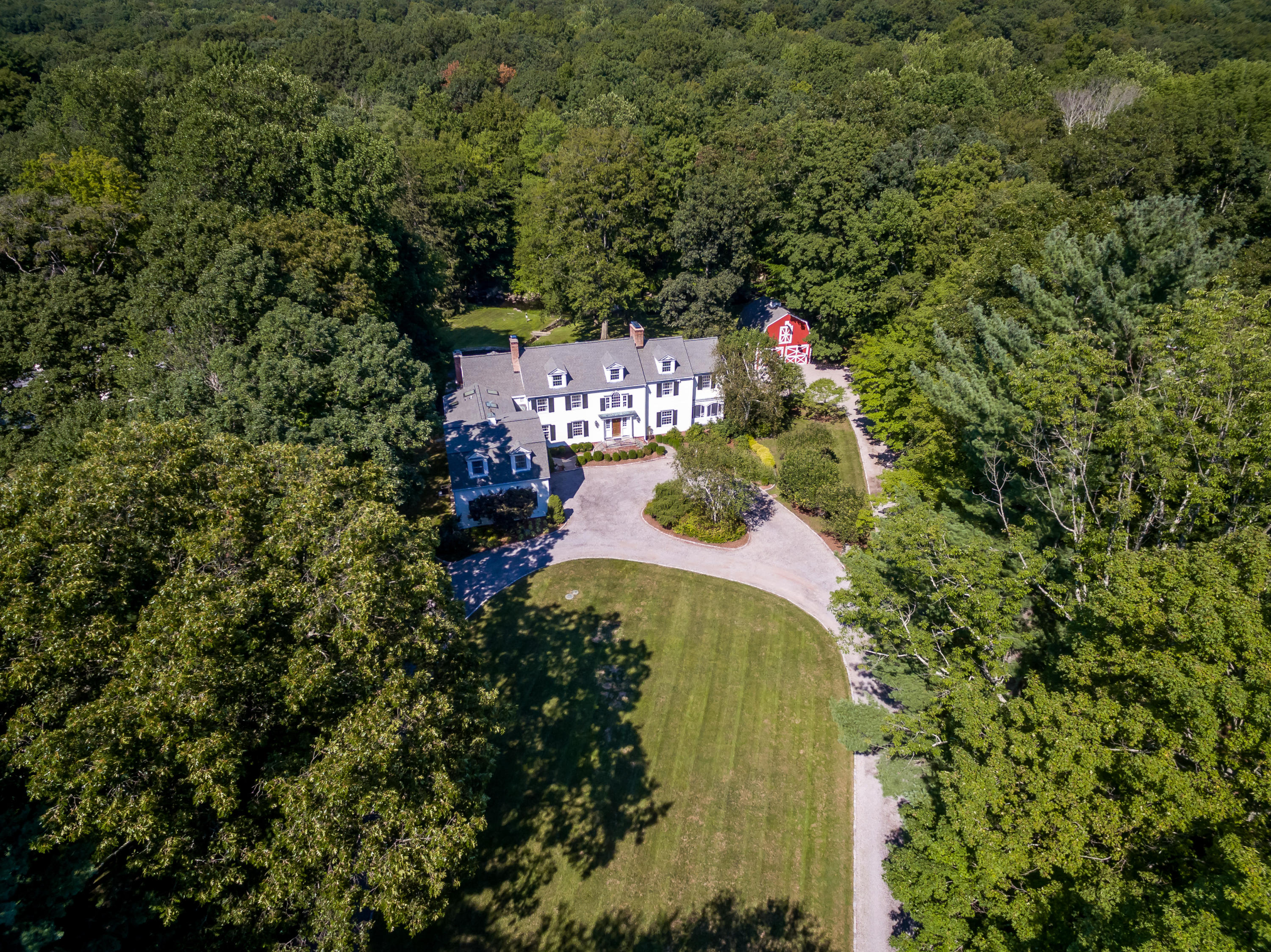 447 Valley Road New Canaan, CT 06840 - Photo 43 of 49 an aerial view of a house with a yard and a large trees