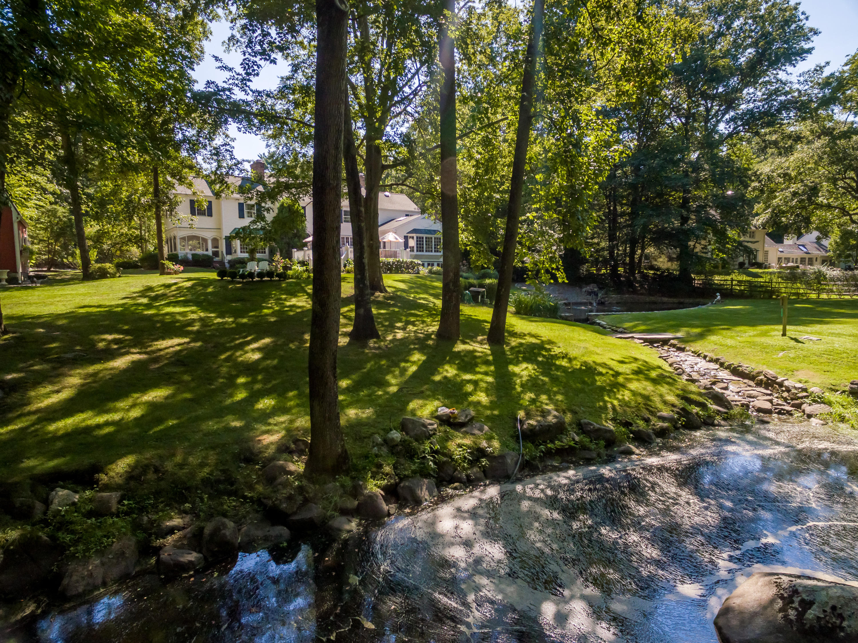 447 Valley Road New Canaan, CT 06840 - Photo 45 of 49 a view of a yard with plants