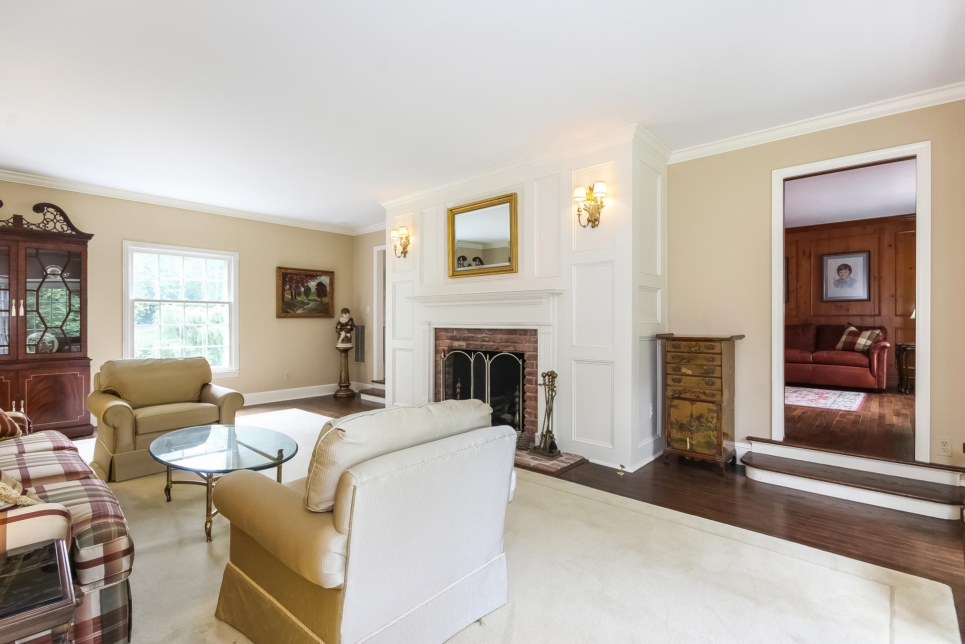 447 Valley Road New Canaan, CT 06840 - Photo 7 of 49 a living room with furniture and a fireplace