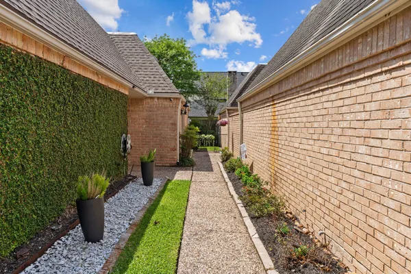 a view of a pathway with a house in the background