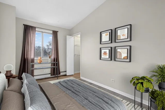 a bedroom with furniture and a window