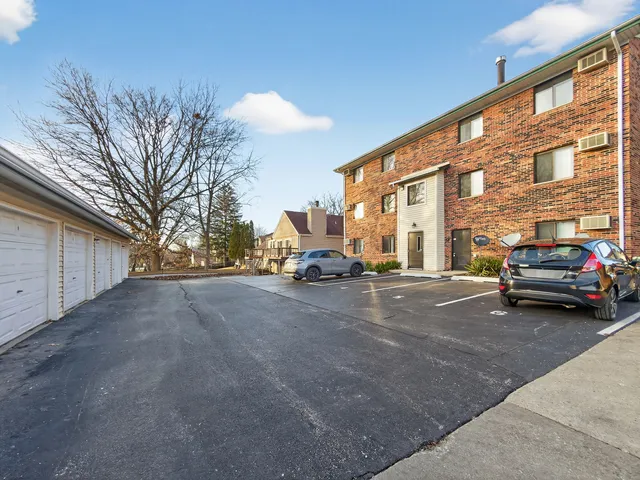 a view of a car parked in front of a building