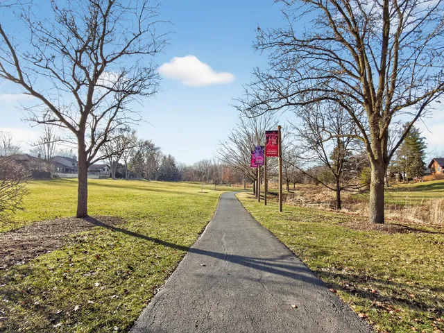 a view of a yard with a house