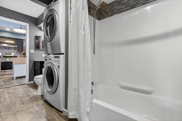 a view of bathroom with washer and dryer