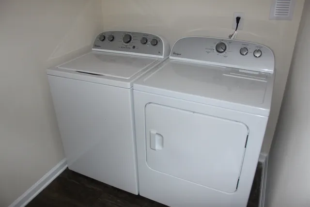a utility room with dryer and washer