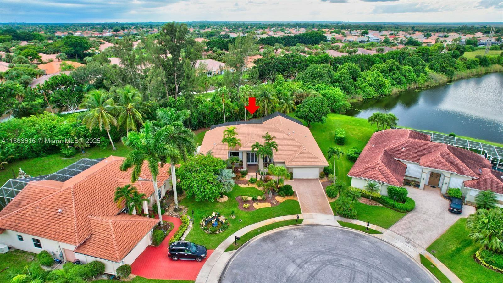 17969 Fairoaks Way Boca Raton, FL 33498 - Photo 1 of 24 an aerial view of multiple houses with yard