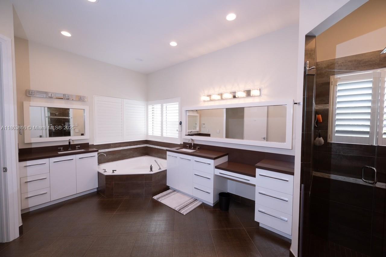 17969 Fairoaks Way Boca Raton, FL 33498 - Photo 12 of 24 a kitchen with granite countertop a stove a sink and a refrigerator
