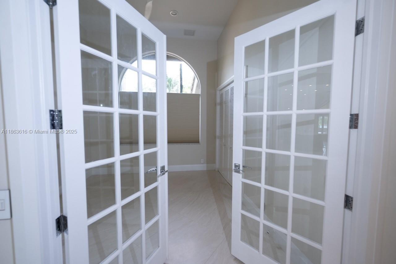 17969 Fairoaks Way Boca Raton, FL 33498 - Photo 15 of 24 a view of an empty room with a window